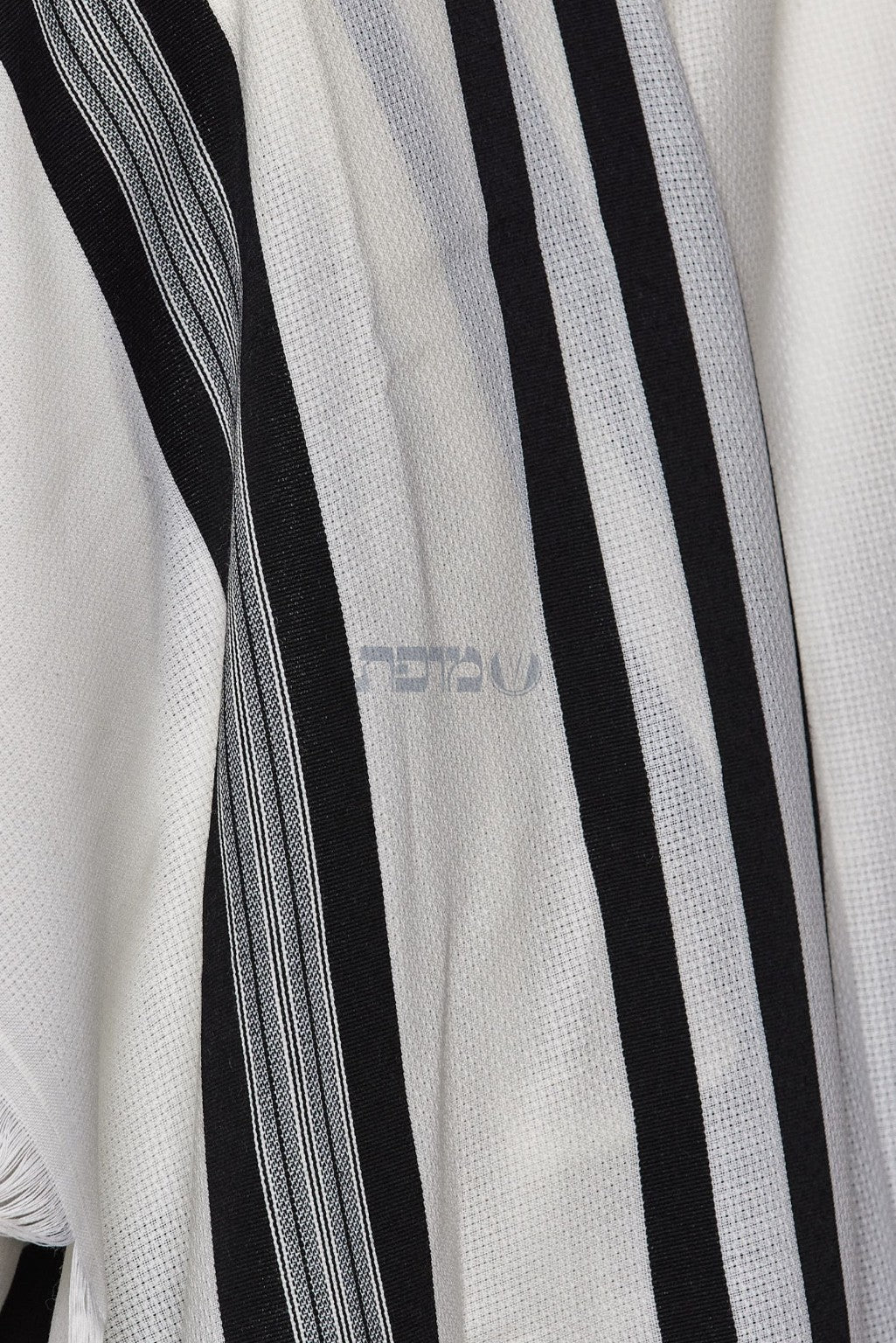 Close-up of black stripes and fine woven detailing