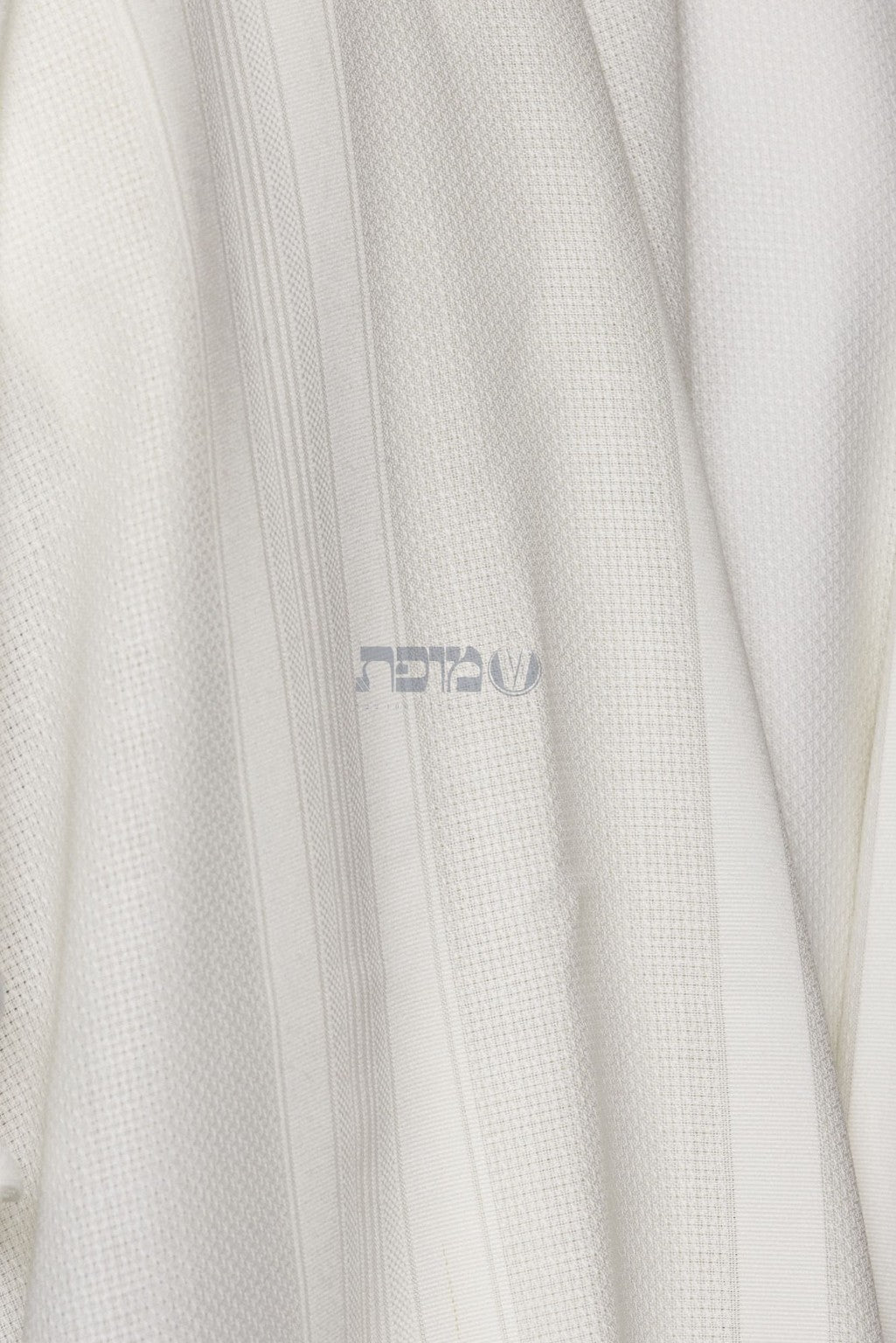 White tallit texture and subtle woven stripe detail